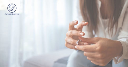 a woman fidgeting with her wedding ring